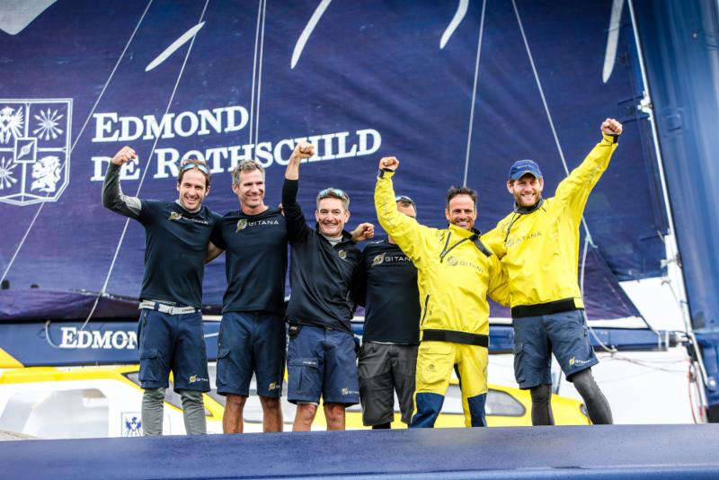 The crew of Ultim Maxi Edmond de Rothschild celebrate their record-breaking run today. Skippers (right) Franck Cammas / Charles Caudrelier with David Boileau
