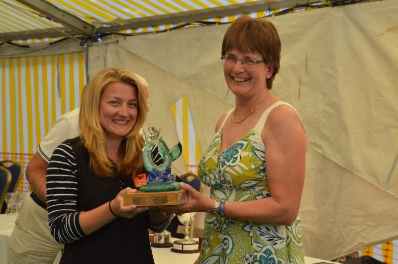 Squib sailor Emma Baker receives the Ariel Trophy from Pam Mansfield