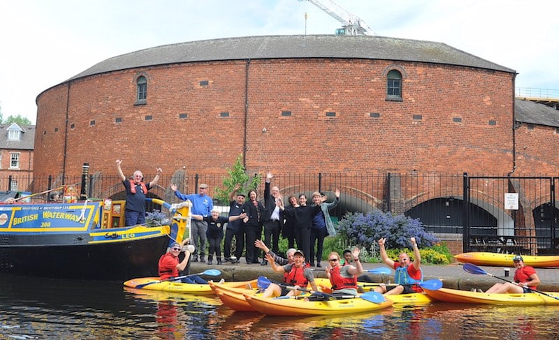 Staff from the Canal & River Trust and National Trust are joined by heritage working boat volunteers and canoeists from B-Row to celebrate the £2.5 National Lottery Grant
