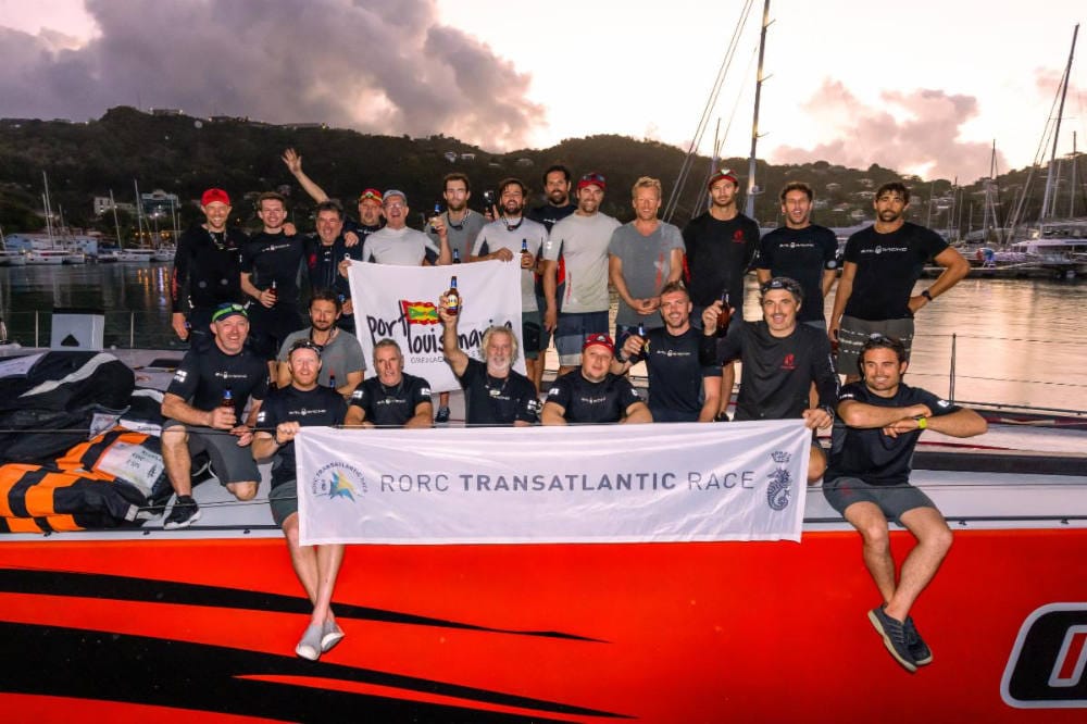 Comanche crew celebrate setting a new race record in the 2022 RORC Transatlantic Race after completing the race to Grenada in record time: 7d 22hrs 1min 4secs © Arthur Daniel/RORC